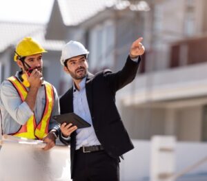 civil-engineer-construction-architecture-worker-are-working-construction-site-with-tablet-blueprints-planing-about-new-construction-sitecooperation-teamwork-concept (1)